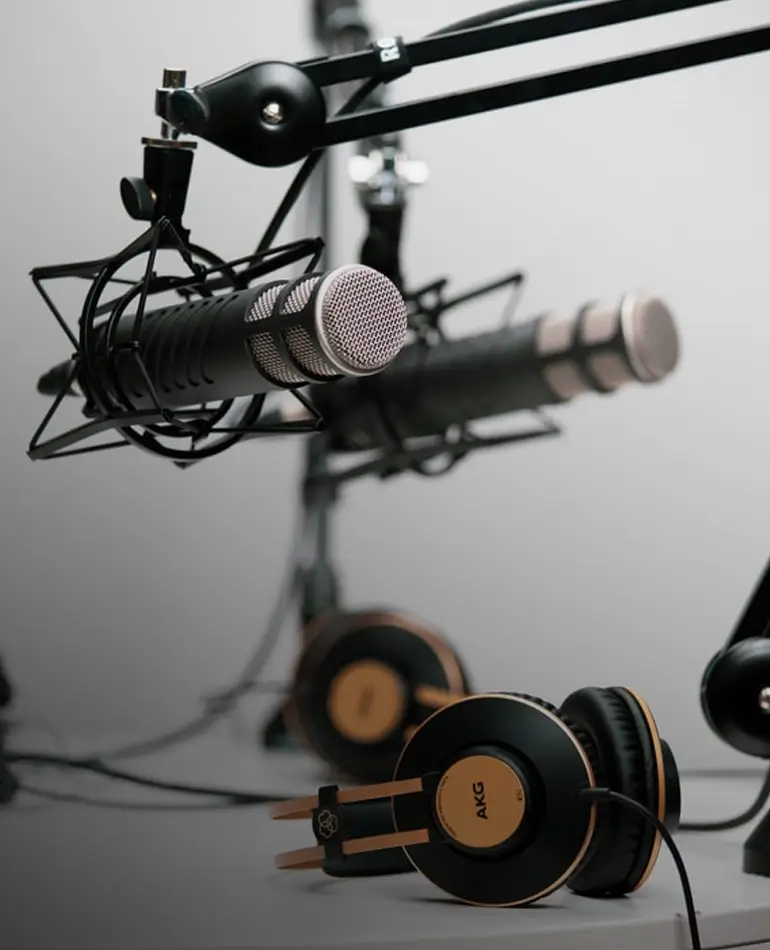 the download success podcast studio with recording microphones and headphones